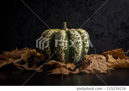 Sweet dumpling pumpkin on black table. 133239216