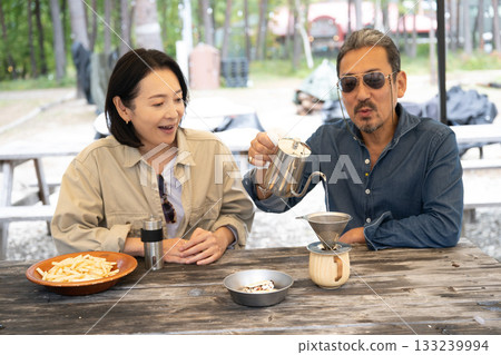A family enjoying cooking at a campsite in Yatsugatake, Yamanashi 133239994