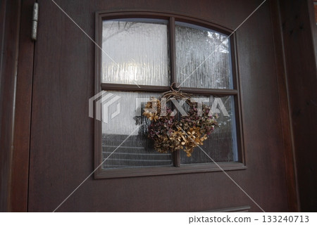 A wreath decorated at the entrance 133240713