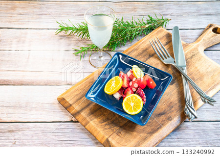 Hors d'oeuvres served on a blue plate 133240992