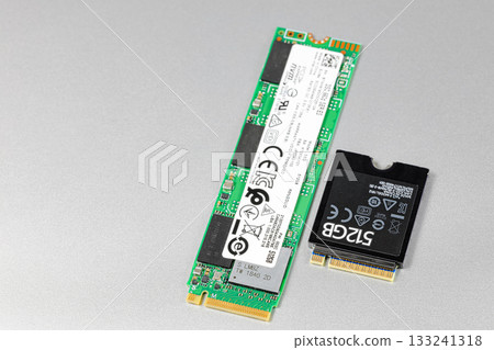 NVME PCIe solid-state drive in the M.2 2230 and 2280 form factor isolated on metal background. NVME PCIe solid-state drive in the M.2 2230 and 2280 form factor isolated on metal background. 133241318