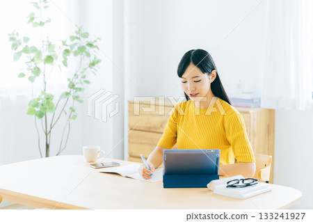 College students studying online in the living room 133241927