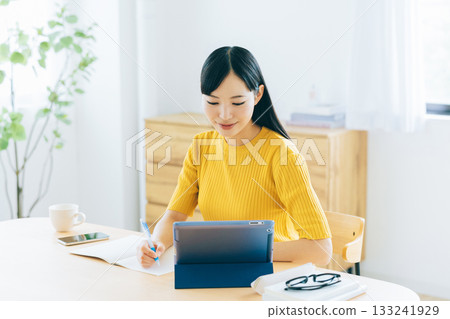 College students studying online in the living room 133241929