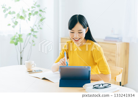 College students studying online in the living room College students studying online in the living room 133241934