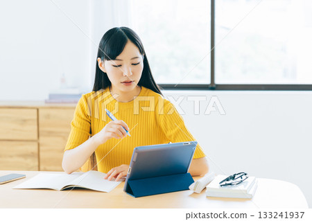 College students studying online in the living room 133241937