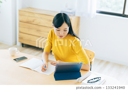College students studying online in the living room 133241940