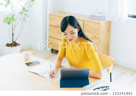 College students studying online in the living room 133241941