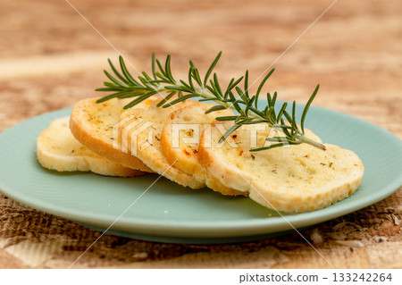 Garlic rusks garnished with rosemary Garlic rusks garnished with rosemary 133242264