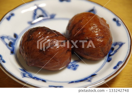 Chestnuts simmered in their skins Chestnuts simmered in their skins 133242748