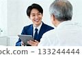 Smiling male staff member and senior man consulting 133244444