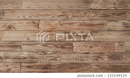Horizontal background image of an aged plank wall of light brown rough-sawn lumber with wood grain Horizontal background image of an aged plank wall of light brown rough-sawn lumber with wood grain 133244524