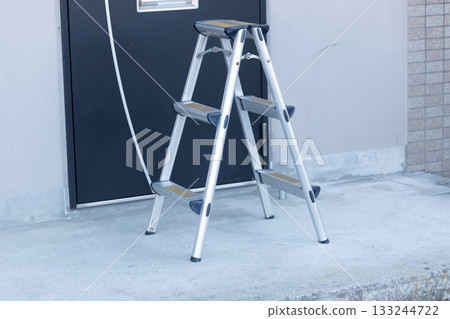Stepladder in front of the apartment entrance with anti-slip tape Stepladder in front of the apartment entrance with anti-slip tape 133244722