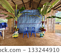 Simple and beautiful traditional Lahu wedding setup in northern Thailand, decorated with banana trees and colorful flowers. 133244910