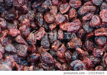 Drying fruits in the sunlight showcases vibrant colors and rich textures of nature's bounty during autumn harvest Drying fruits in the sunlight showcases vibrant colors and rich textures of nature's bounty during autumn harvest 133245825