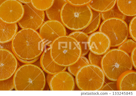 Vibrant orange slices create a colorful display of freshness perfect for summer recipes and healthy snacks Vibrant orange slices create a colorful display of freshness perfect for summer recipes and healthy snacks 133245845