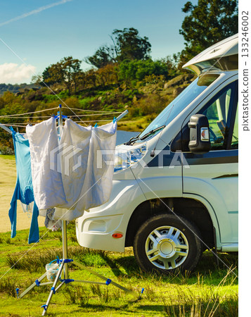 Camping. Clothes hanging to dry by camper rv. Camping. Clothes hanging to dry by camper rv. 133246002
