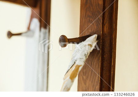 Person renovating wooden hanger Person renovating wooden hanger 133246026