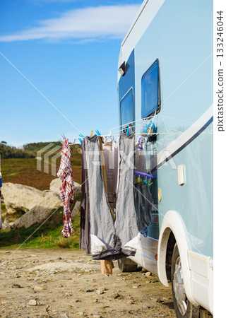 Washing laundry hanging to dry outdoors at caravan 133246044