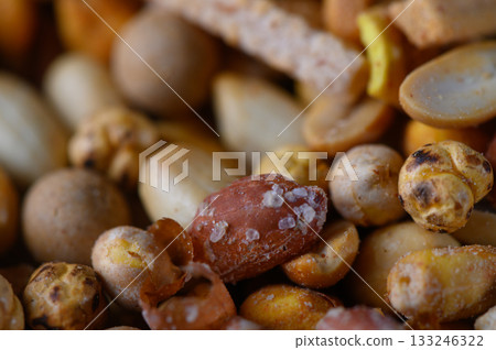 Assorted nuts and seeds create a colorful and inviting snack mix filled with flavor and texture Assorted nuts and seeds create a colorful and inviting snack mix filled with flavor and texture 133246322
