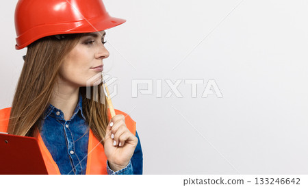 Woman engineer construction builder in helmet. Woman engineer construction builder in helmet. 133246642