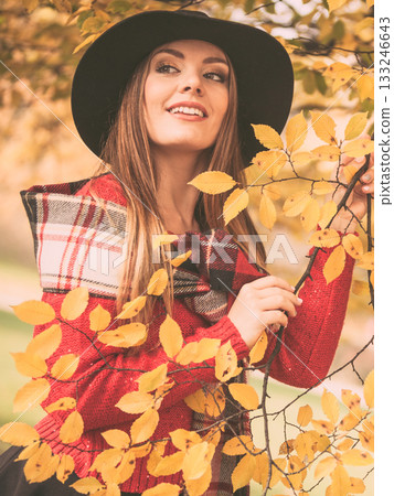 Charming woman walking in autumnal park 133246643