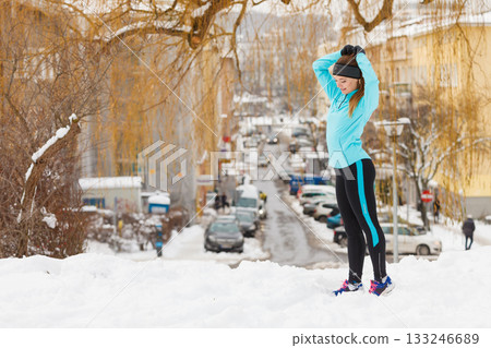 Young woman outside during winter. 133246689