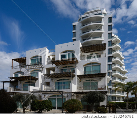 Modern architectural marvel in a sunny coastal location showcasing a stunning skyline Modern architectural marvel in a sunny coastal location showcasing a stunning skyline 133246791