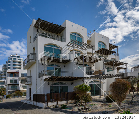 Modern seaside architecture with unique design and intricate details in bright daylight 133246934