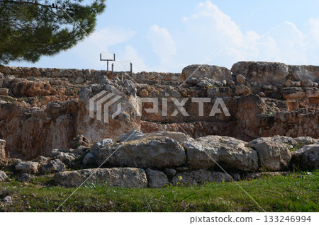 Historical ruins under a bright sky highlighting ancient stone structures and the passing of time 133246994