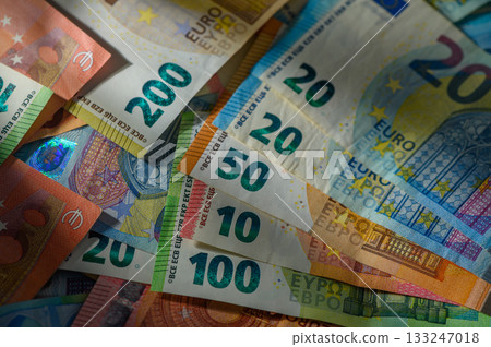Currency collection showcasing various Euro denominations in vibrant colors and details on a flat surface Currency collection showcasing various Euro denominations in vibrant colors and details on a flat surface 133247018