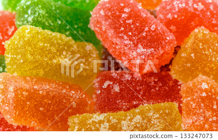 Colorful assortment of gummy candies brings joy to every sweet tooth in a bright, vibrant setting Colorful assortment of gummy candies brings joy to every sweet tooth in a bright, vibrant setting 133247073