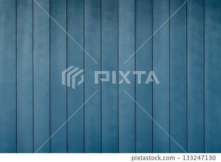 Modern blue wall with vertical panels showcasing a minimalist aesthetic in natural lighting 133247130