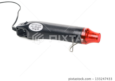 Compact electric heat gun isolated on white background 133247433