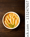 A traditional Japanese dish of unbleached and unprocessed herring roe served in a wooden barrel (wood grain background) 133247607