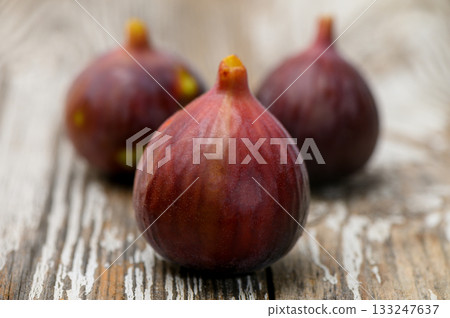 Organic ripe fig placed on rustic wood Organic ripe fig placed on rustic wood 133247637