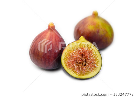 Purple sliced fig fruit isolated on white background Purple sliced fig fruit isolated on white background 133247772