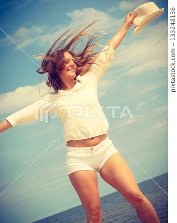 Happy woman on summer beach. Happy woman on summer beach. 133248136