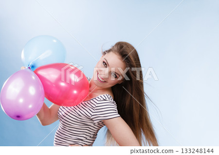 Woman summer joyful girl with colorful balloons 133248144