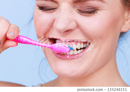 Woman brushing cleaning teeth Woman brushing cleaning teeth 133248151