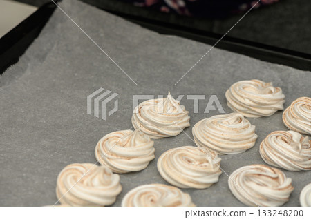 Swirls of sweetness line the baking tray, ready for a delicious oven transformation Swirls of sweetness line the baking tray, ready for a delicious oven transformation 133248200