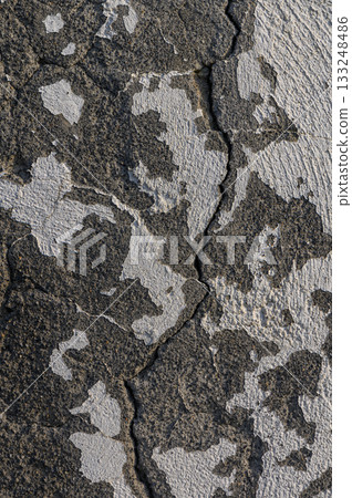 Textured surface reveals age and wear, showcasing nature's artistry in urban decay Textured surface reveals age and wear, showcasing nature's artistry in urban decay 133248486