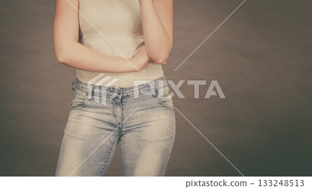 Woman wearing tight slim jeans and white tshirt 133248513