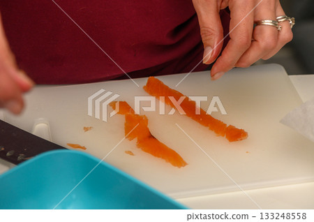 Expertly slicing fresh vegetables in a modern kitchen preparing for a delicious meal 133248558