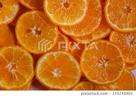 Bright and vibrant slices of fresh oranges ready for a refreshing snack or dessert 133248905