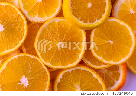 Juicy orange slices arranged artfully showcasing vibrant colors and fresh appeal for culinary inspiration Juicy orange slices arranged artfully showcasing vibrant colors and fresh appeal for culinary inspiration 133249049