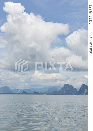 Cloudy sky with scenic mountain view over tranquil water in natural landscape Cloudy sky with scenic mountain view over tranquil water in natural landscape 133249271