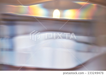 Abstract light refractions with soft colors through rippled glass surface Abstract light refractions with soft colors through rippled glass surface 133249478