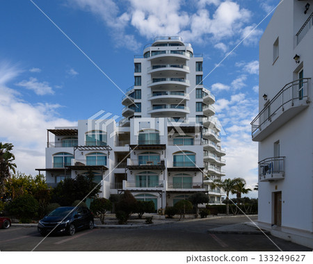 Modern architecture shines under a clear blue sky in beachfront hotel setting Modern architecture shines under a clear blue sky in beachfront hotel setting 133249627