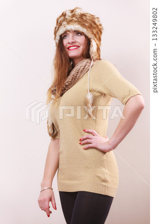 Winter woman in warm clothing fur cap 133249802