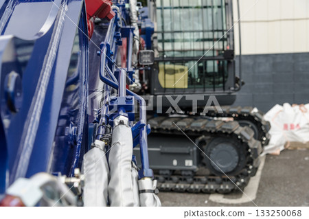 [Store demolition and heavy machinery caterpillar tracks] 133250068